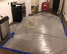 Floor rescue process during water damage remediation process by PuroClean Property Restoration Specialists Chicago IL