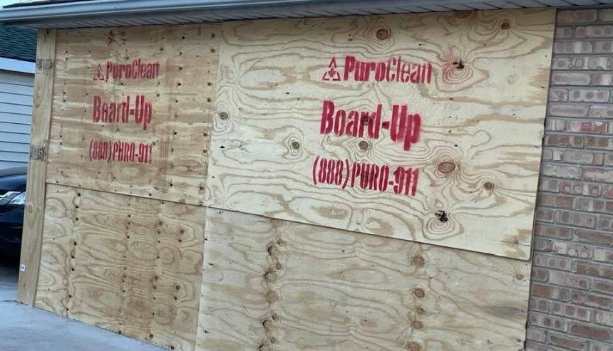 PuroClean garage board up after car smashed into home.