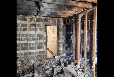 Professional emergency fire damage cleanup services restoring residential property after a fire.