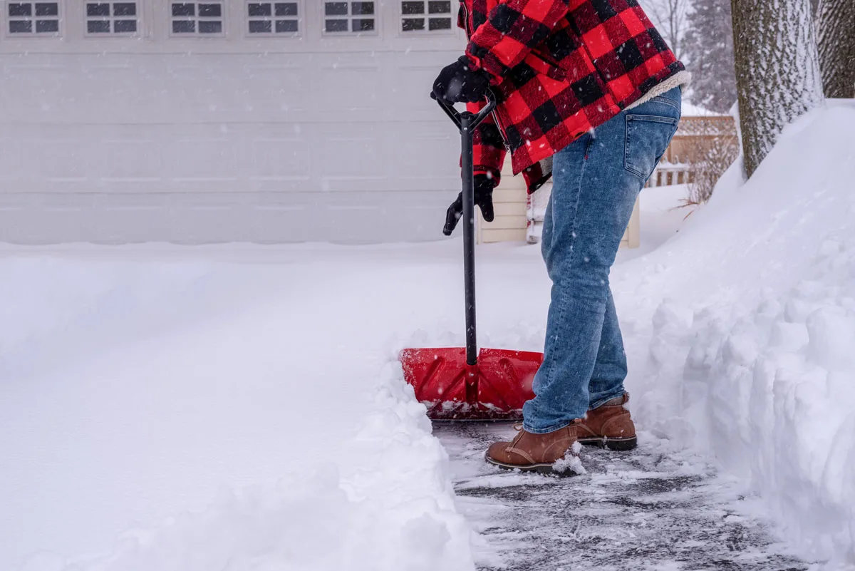 Man shoveling snow after snow storm - how to