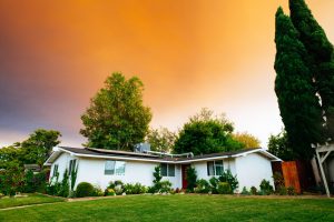 home flooding hazards - home with spring sky