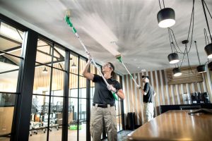 Commercial interior undergoing professional cleaning after damage