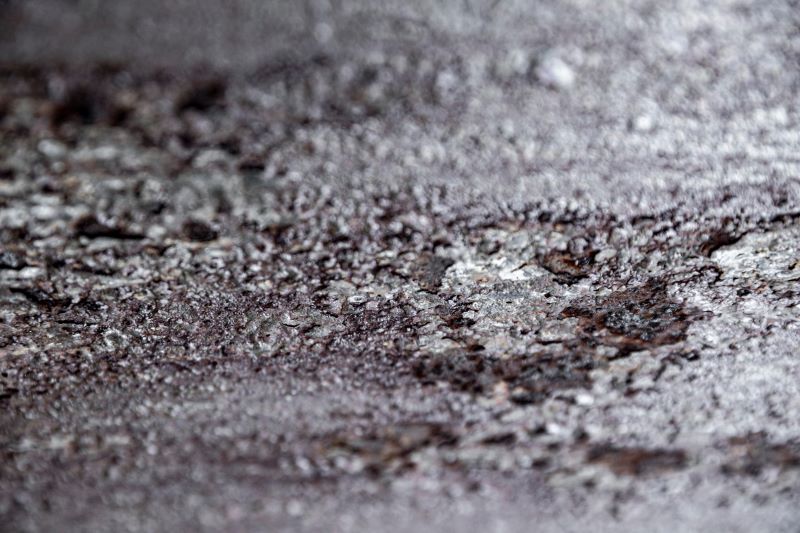 Close-up of soot accumulation on surfaces