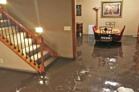 emergency water restoration team extracting water inside residential home after flooding Covington Louisiana