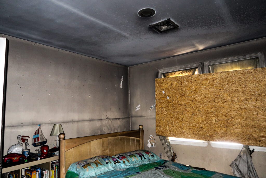 smoke and soot damage on walls after house fire