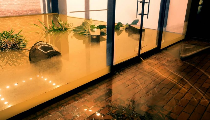 Flooded commercial property interior in Covington LA requiring emergency water restoration services to minimize business downtime