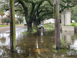 Flooded residential neighborhood in Covington LA with contaminated stormwater following a hurricane or tropical storm event requiring professional flood clean up
