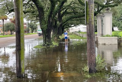 Flooded residential neighborhood in Covington LA with contaminated stormwater following a hurricane or tropical storm event requiring professional flood clean up