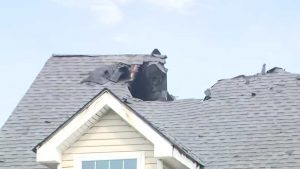 Roof fire damage caused by a lightning strike on a residential home in Covington LA during a severe thunderstorm