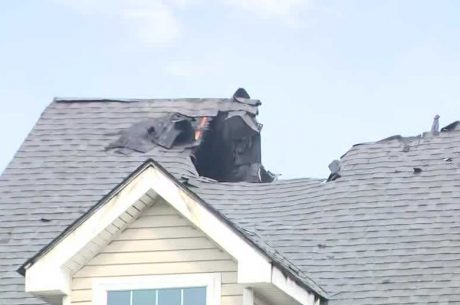 Roof fire damage caused by a lightning strike on a residential home in Covington LA during a severe thunderstorm