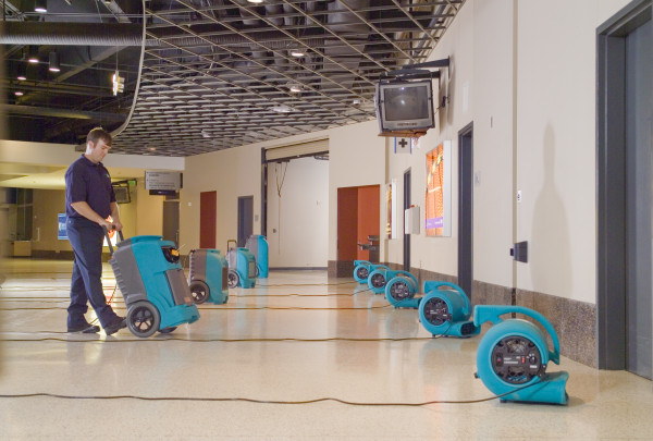 commercial cleaning team working inside a business facility after water damage