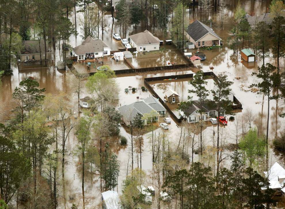 Flood damage on a residential street in Covington LA following a severe storm event requiring professional flood damage restoration and clean up services