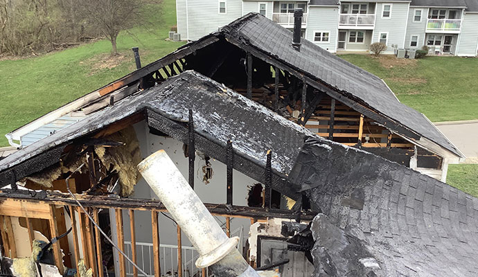 Fire damage restoration assessment on an older historic wood-frame home in Mandeville LA near Lake Pontchartrain requiring specialized restoration approach