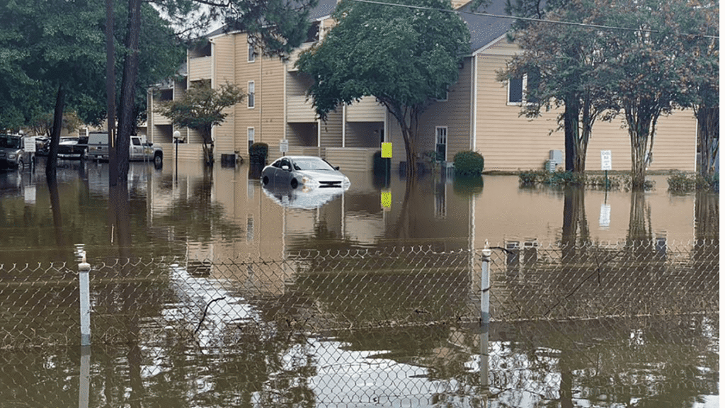 Sudden severe thunderstorm causing rapid street flooding in a Mandeville LA neighborhood requiring immediate emergency water restoration response