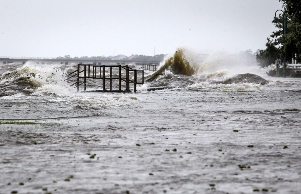 Storm surge from Lake Pontchartrain flooding residential streets near the Slidell LA waterfront requiring emergency water restoration and contamination remediation