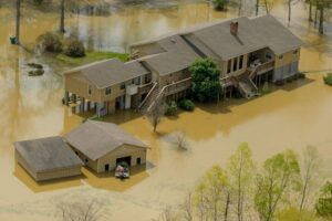 Older slab-on-grade home in Slidell LA neighborhood showing repetitive flood damage requiring professional flood clean up and restoration services