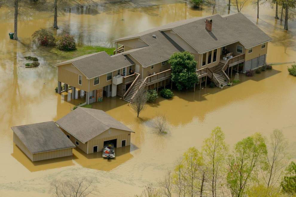 Older slab-on-grade home in Slidell LA neighborhood showing repetitive flood damage requiring professional flood clean up and restoration services