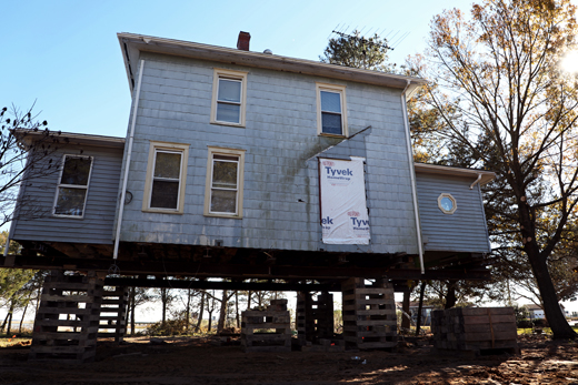 Elevated pier-and-beam home in Slidell LA showing fire damage requiring specialized emergency fire restoration approach for flood zone construction