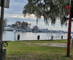 Waterfront marina and boatyard property in Madisonville LA along the Tchefuncte River showing water damage restoration needs for marine industry and residential waterfront properties