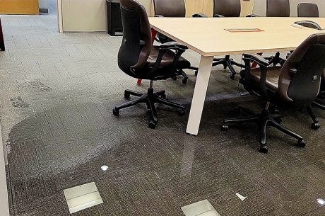 Office with water-damaged floors (carpet tiles)