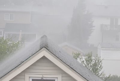 Heavy rain over rooftops, a flood in the making