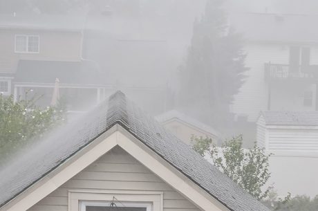 Heavy rain over rooftops, a flood in the making