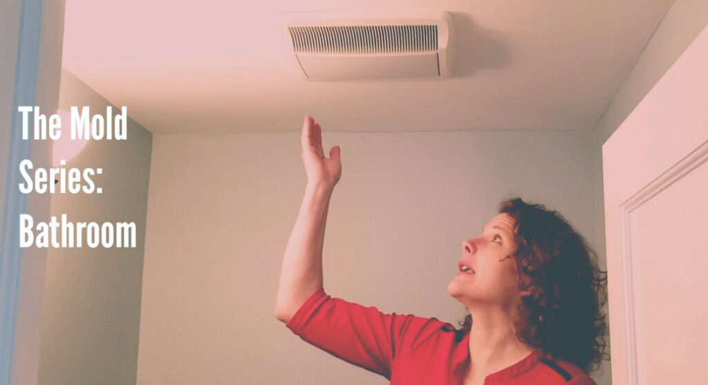 woman gesturing at bathroom exhaust fan