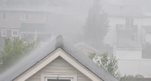 Heavy rain over rooftops, a flood in the making