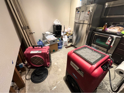 PuroClean air scrubbers and drying equipment in a residential kitchen during residential water damage cleanup in Park Cities/North Dallas.