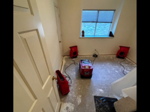Drying equipment in place as part of a home water damage restoration process, helping remove excess moisture and support proper drying inside a residential space.