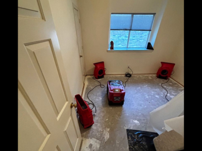 Drying equipment in place as part of a home water damage restoration process, helping remove excess moisture and support proper drying inside a residential space.
