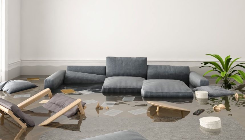 couch and chairs in flooded living room. Spring flooding prevention can help you avoid this scenario,