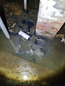 A dark, flooded basement shows dirty water, submerged pipes, and floating debris. TITLE: