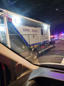 Connecticut State Police Arson & Explosion Investigation Unit truck with flashing emergency lights at night.