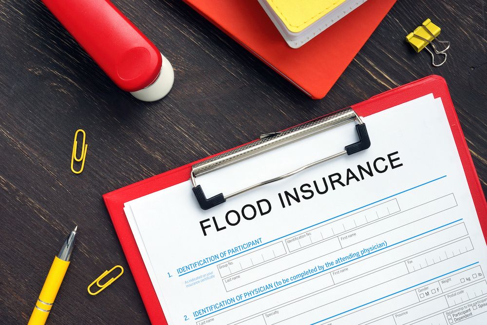 Clipboard depicting a flood insurance policy