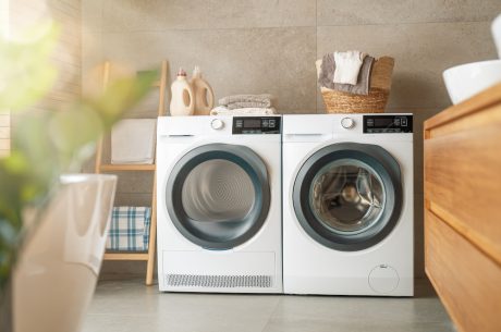 Interior of a real laundry room with a washing machine at home. Dryer safety