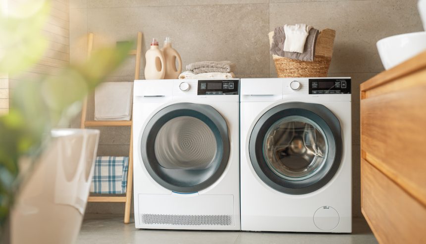 Interior of a real laundry room with a washing machine at home. Dryer safety