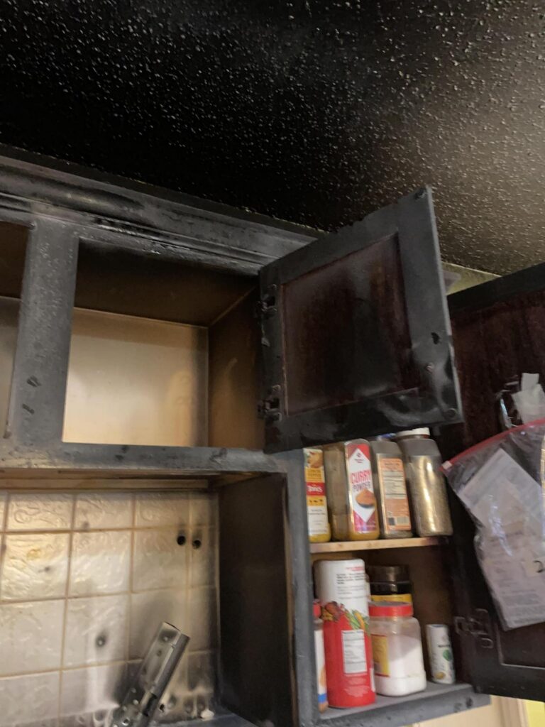 The cooking fire affected the kitchen cabinetry.