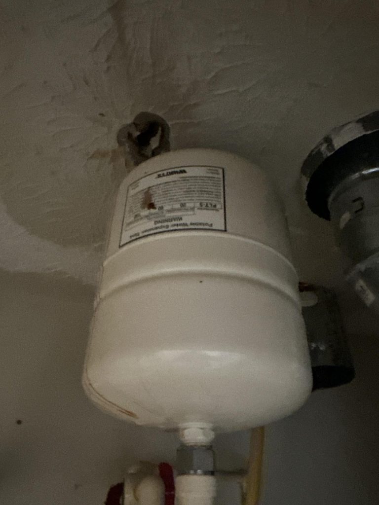 Faulty water heater as a source of water damage on walls and floor