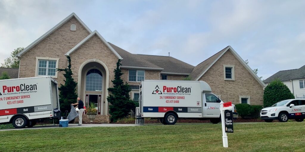 PuroClean trucks in front of house where dryer caught fire