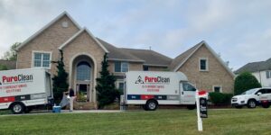 PuroClean trucks in front of house where dryer caught fire