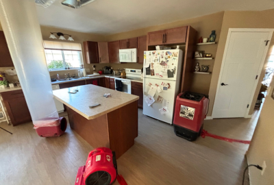 Drying equipment in place as part of a home water damage restoration process, helping remove excess moisture and support proper drying inside a residential space.