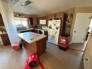 Drying equipment in place as part of a home water damage restoration process, helping remove excess moisture and support proper drying inside a residential space.