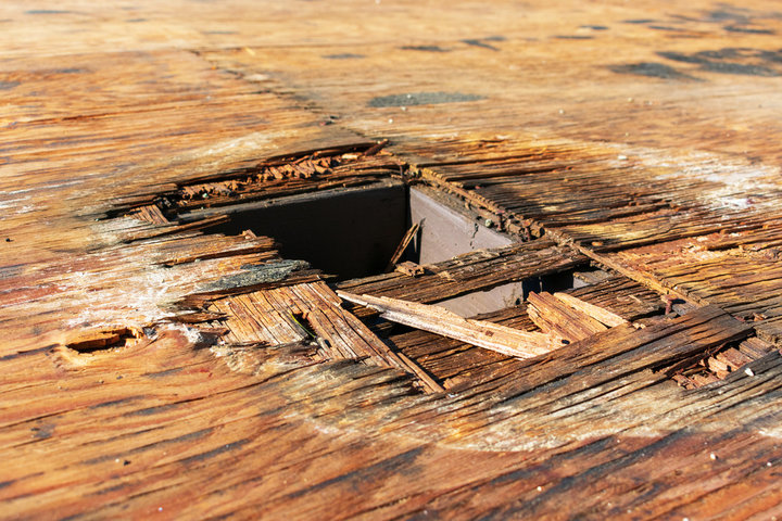 Wet damage on wooden floor.