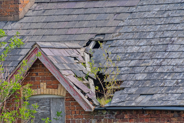 A damaged pitched roof.
