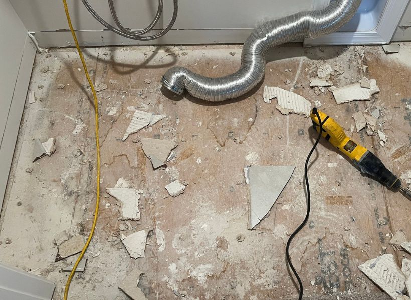 removed flooring and baseboards in the laundry room