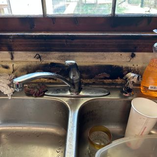 Fire damage melted the sink in this South Carolina kitchen.