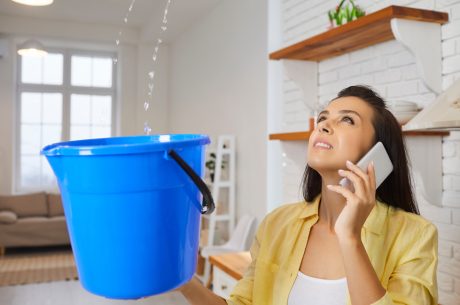 A woman deals with a roof leak