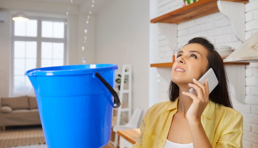 A woman deals with a roof leak