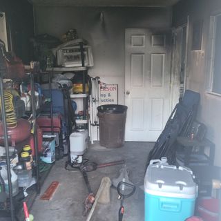 The garage was too small a space for the hot lawnmower.
